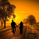 Couple holding hands on a Bike Ride
