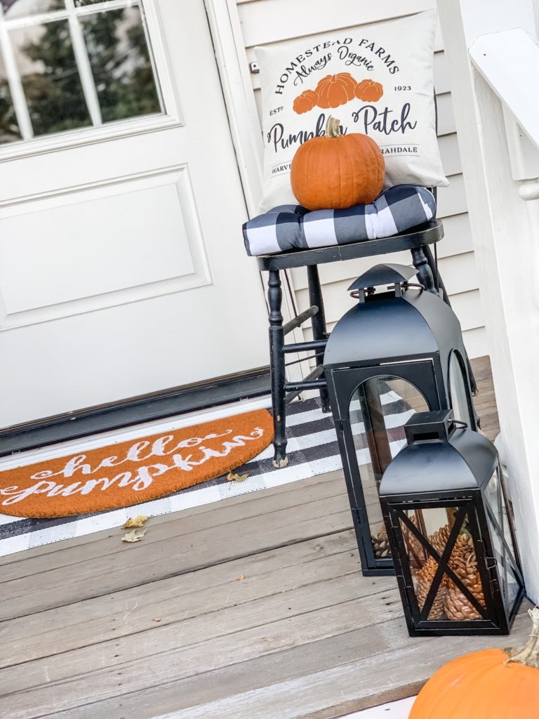 Lantern and chair on front porch
