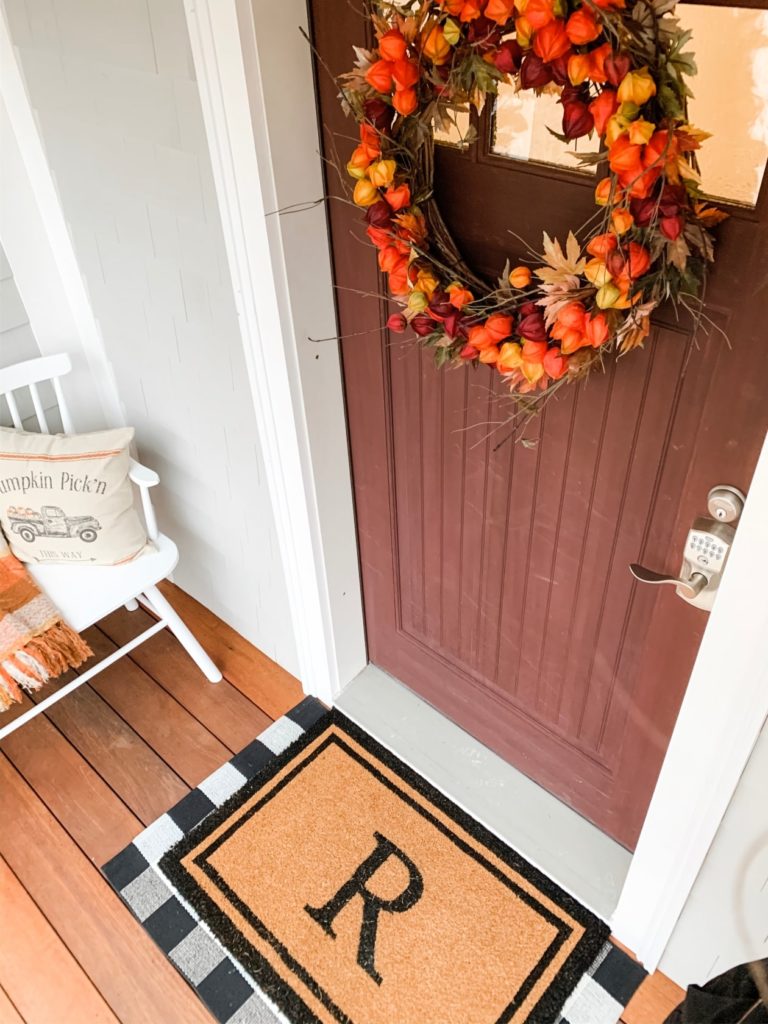 front door with a fall wreath