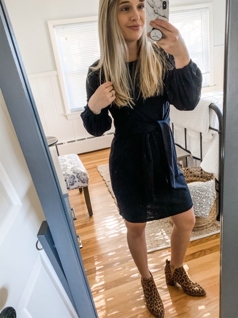 Girl in a sweater dress and boots