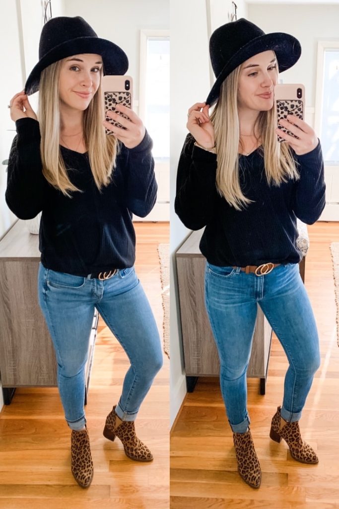 girl with a black shirt, leopard print boots, jeans and belt