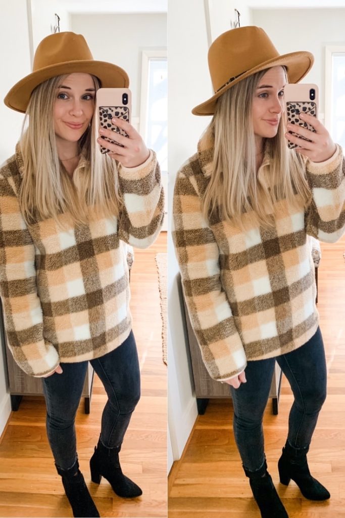 girl with a sherpa sweater, black jeans, hat, and black boots
