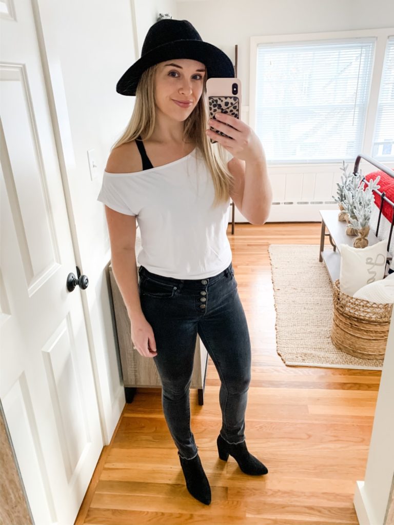 Girl with black hat, white tee shirt, black jeans and black boots