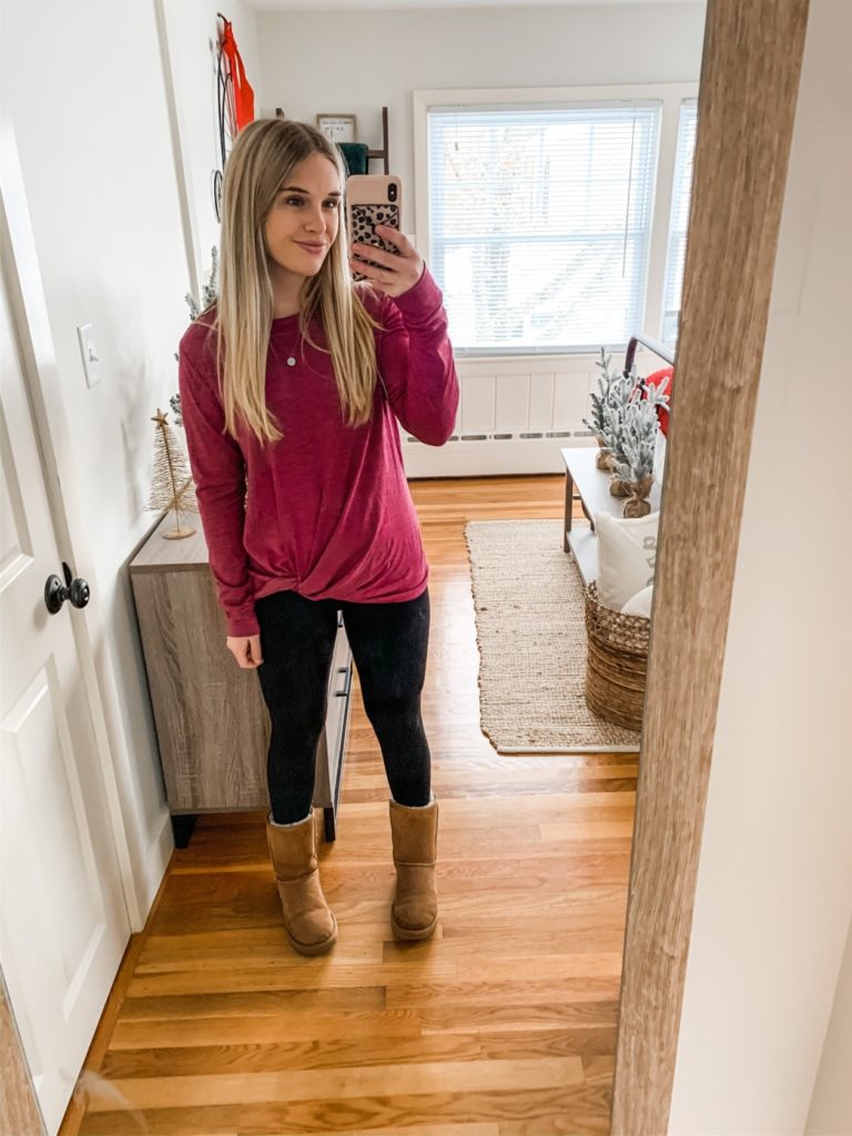 Girl with long sleeve shirt, jeans and uggs