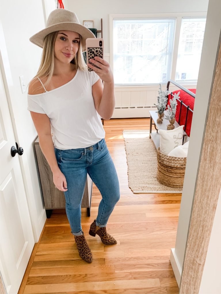 Girl with tan hat, white tee shirt, jeans and leopard boots