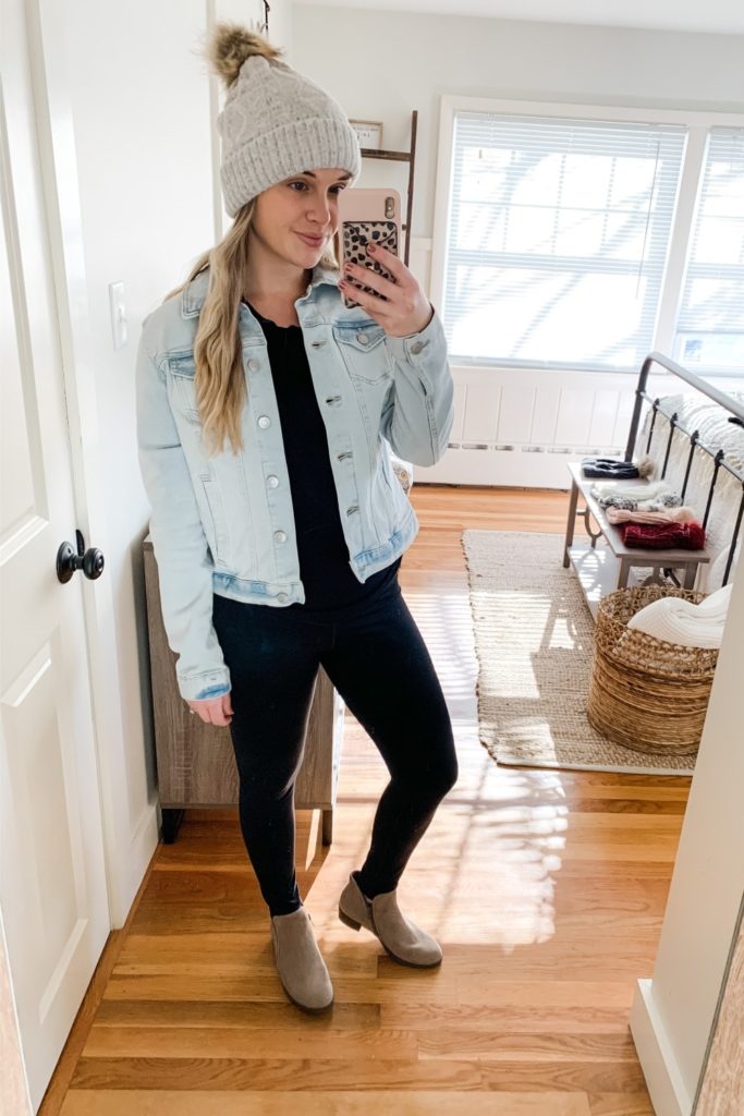 Girl in a jean jacket, pom pom beanie and boots