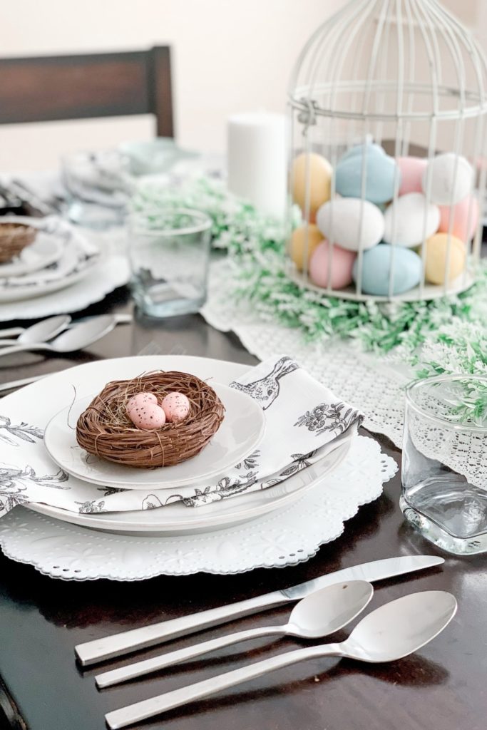 spring tablescape, robin egg nests, tabletop birdcage, pillar candles and wreaths