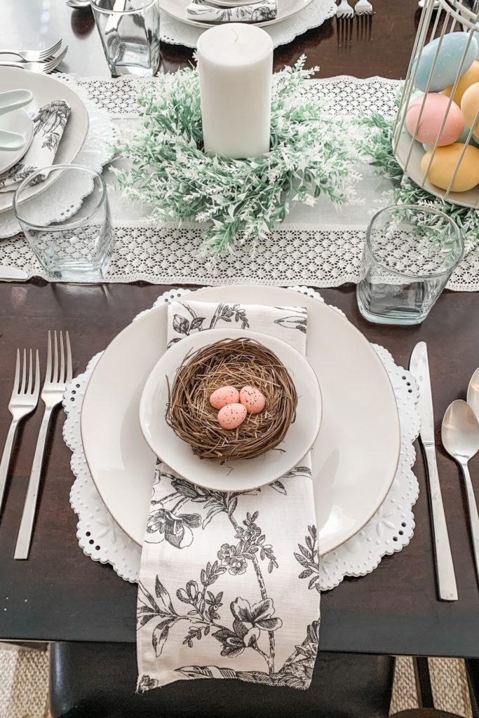 spring tablescape, robin egg nests, tabletop birdcage, pillar candles and wreaths