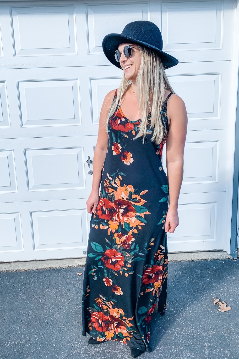 girl wearing black floral maxi dresses