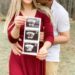 pregnancy announcement, couple holding ultrasound pictures